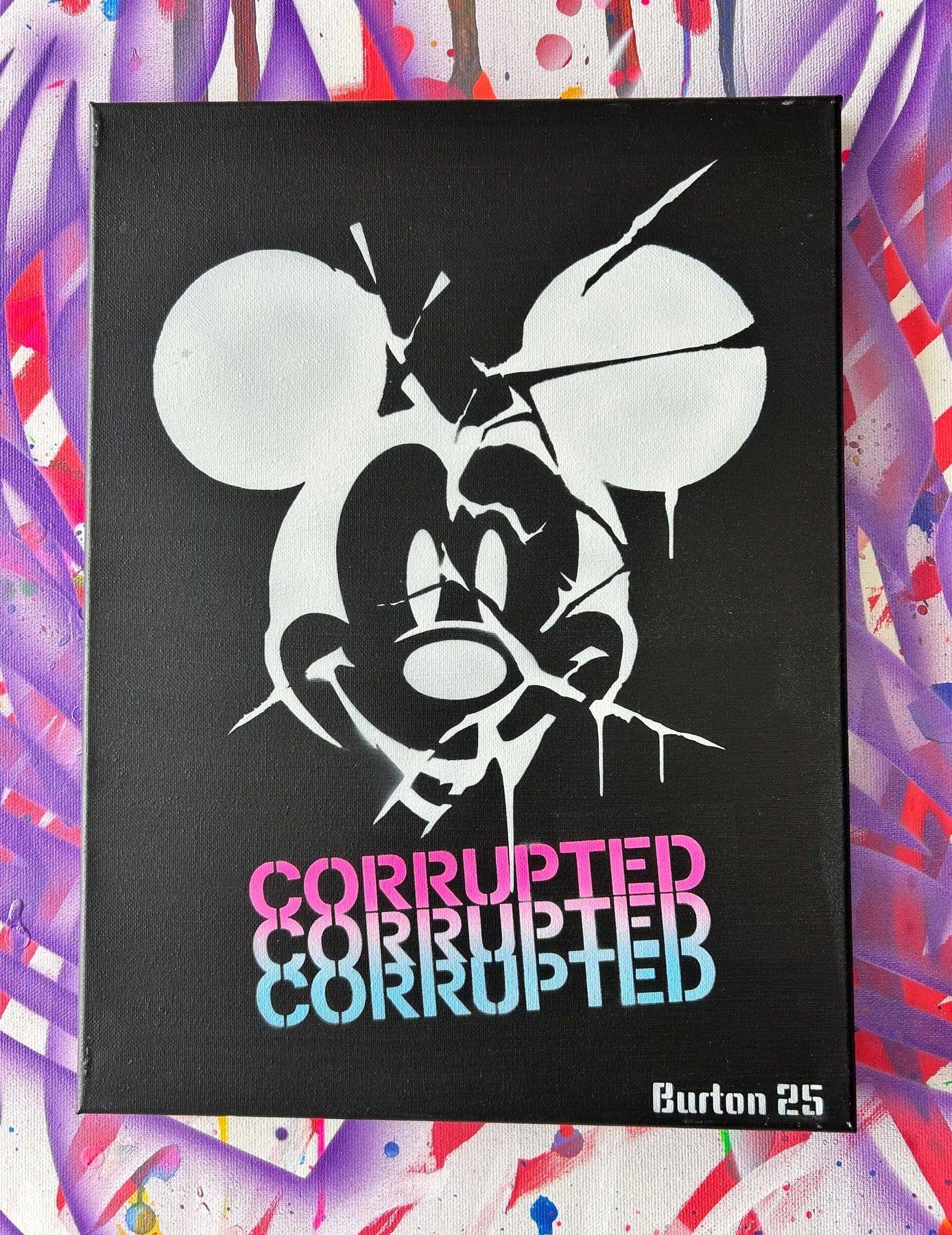 Cracked Mickey Mouse stencil in white on black with Corrupted lettering in a pink-to-blue fade.