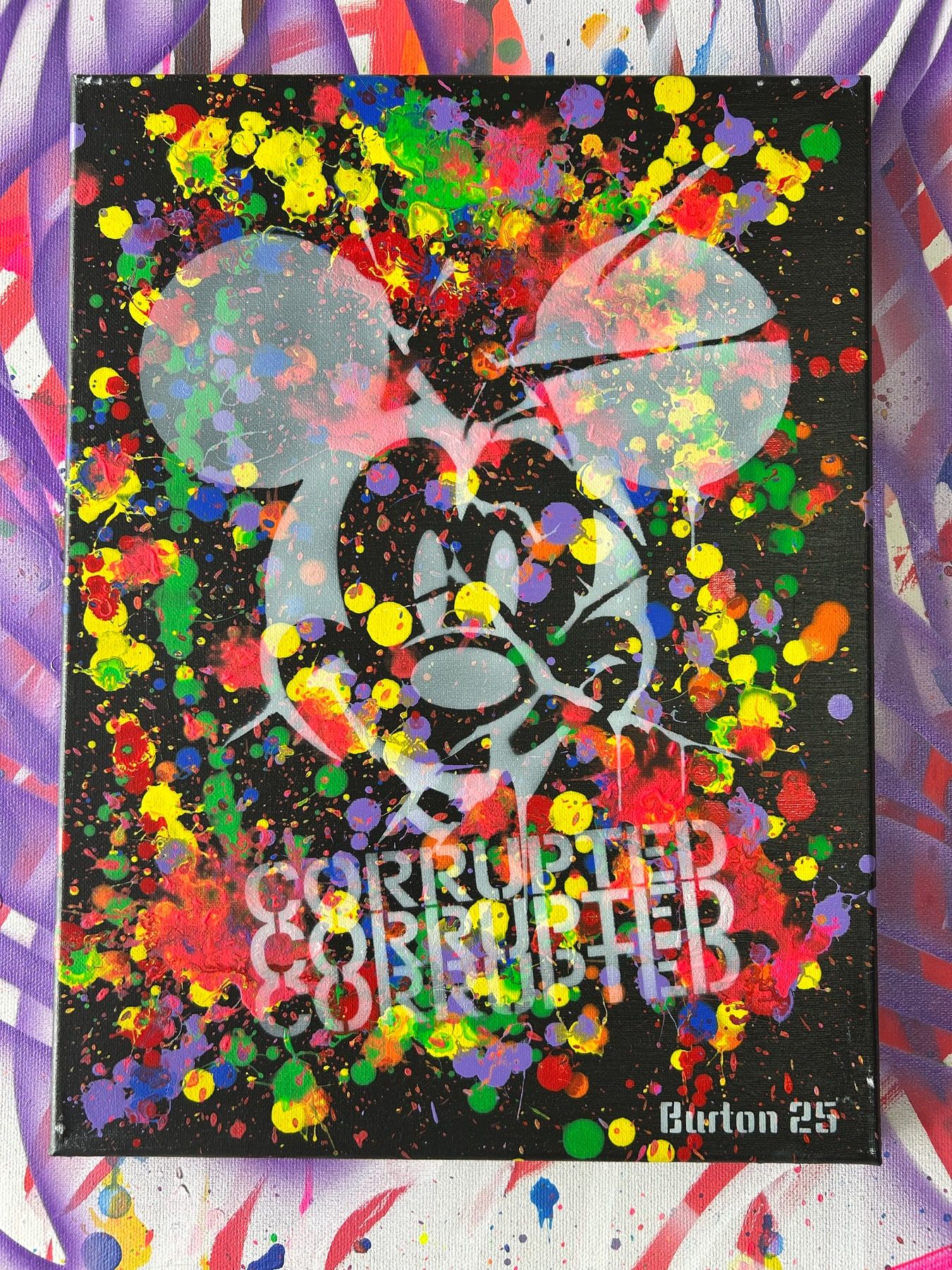 Ghostly Mickey Mouse stencil over rainbow paint splatter on black, with Corrupted lettering.