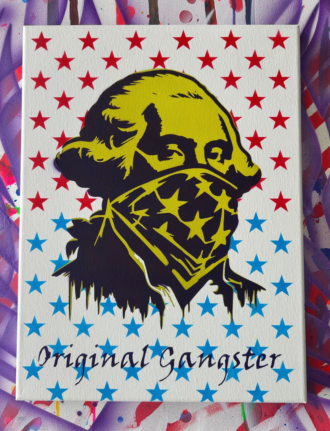 Stencil of George Washington in an American-flag bandana, metallic gold on a red and blue star background, titled Original Gangster.